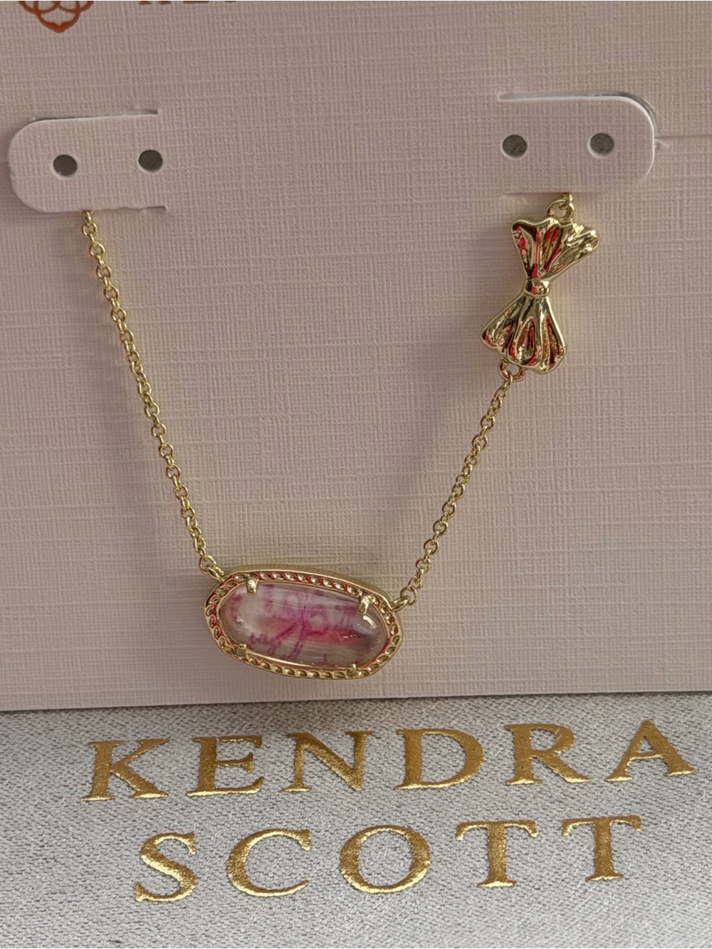 Kendra Scott Gold-tone Necklace with Pink Marble Oval and Bow Charm